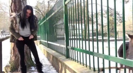 Dark haired chick Lucia Denvile squats for a piss on snowy ground by a park 78528154