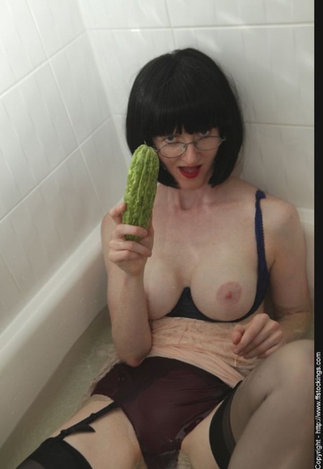 Dressed mature lady in black nylon stockings taking a bath 35557530